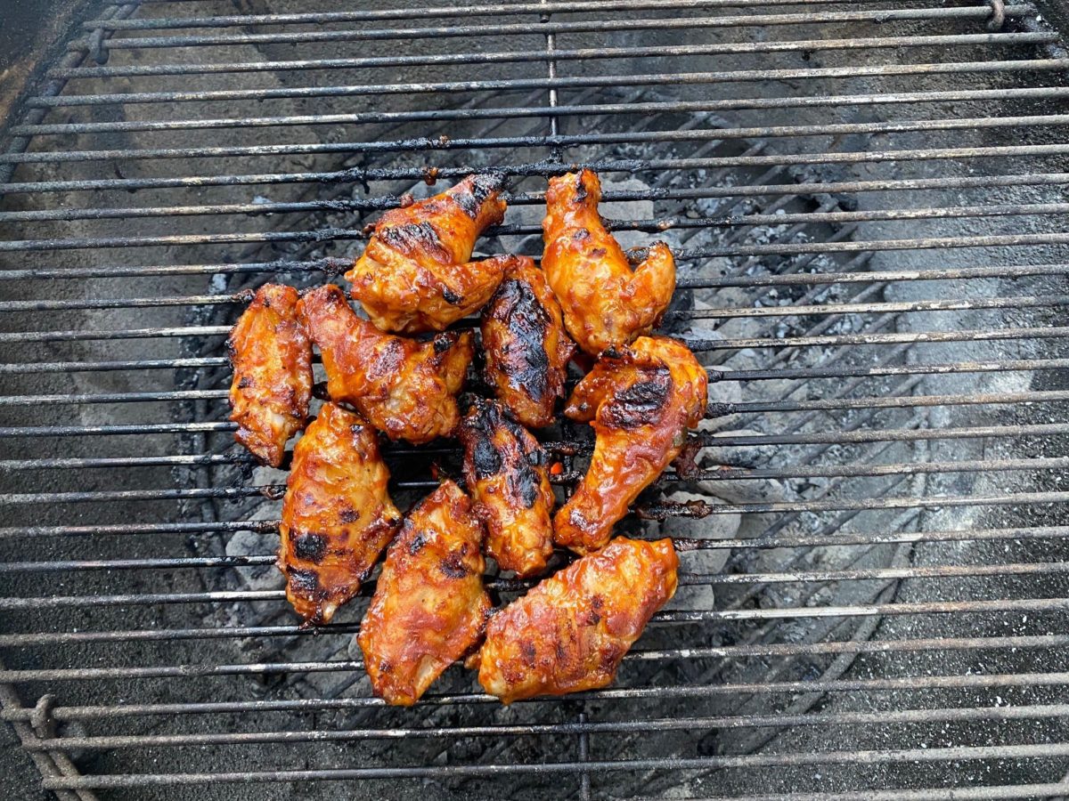 photo image by JeniseCook.com of barbecued chicken on a charcoal grill