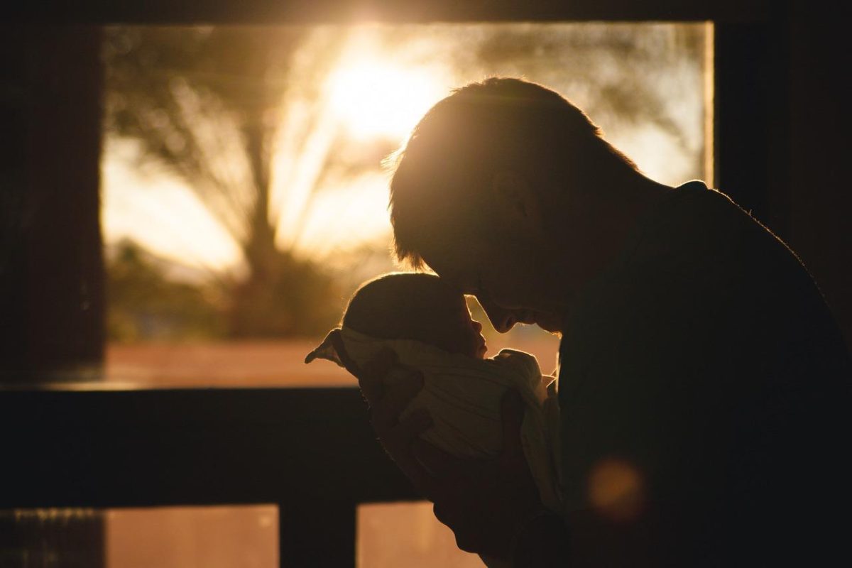 photo of father holding newborn child in silhouette from Pixabay.com