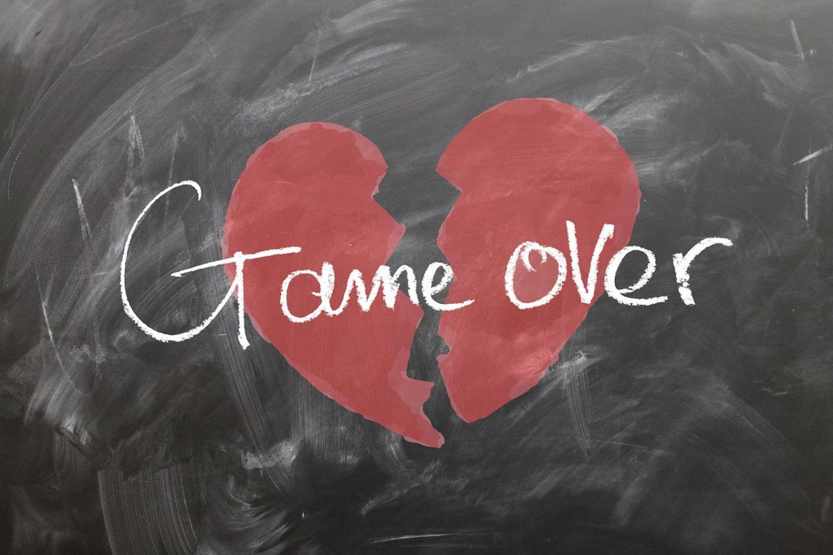 graphic image of a chalk board and a broken heart graphic with words Game Over